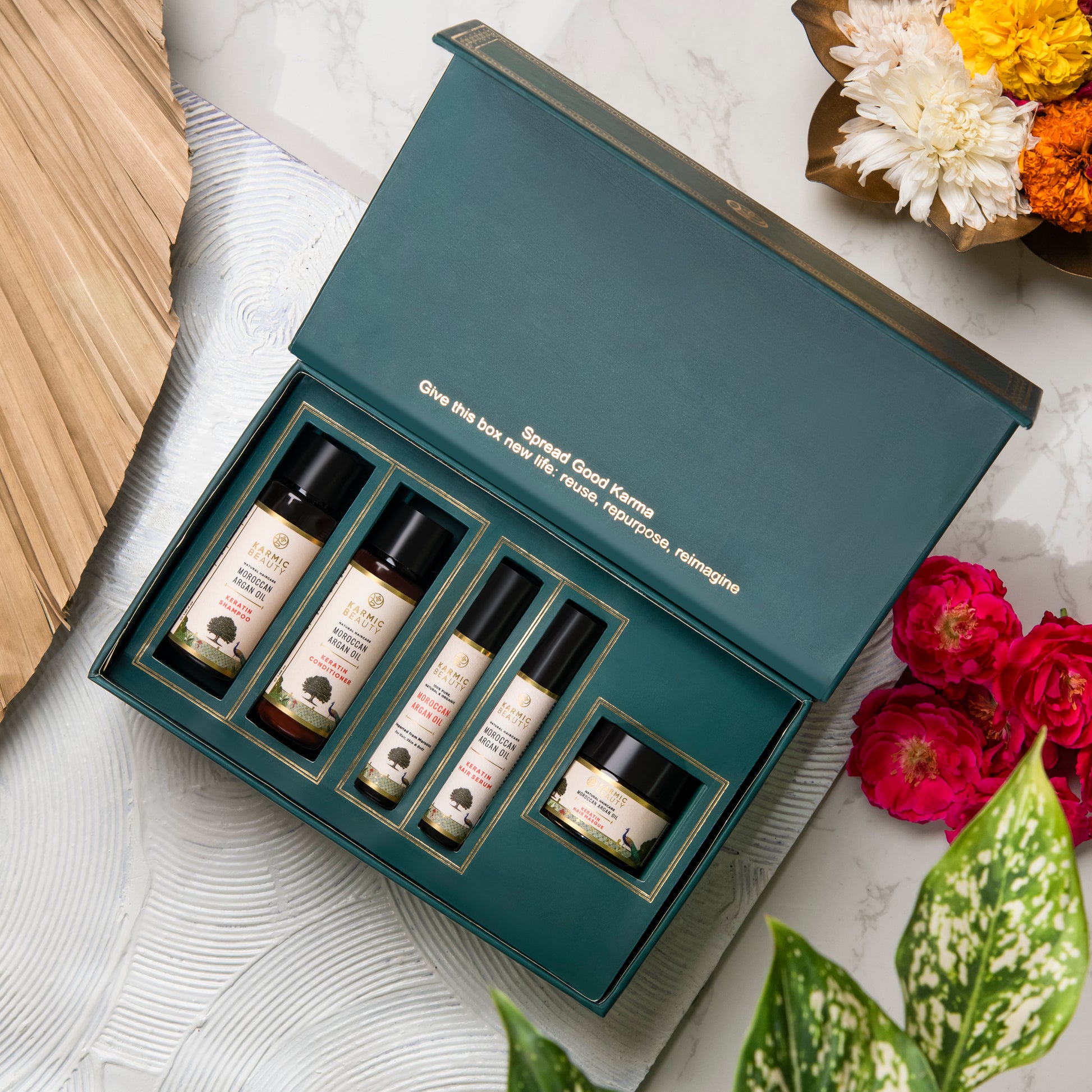 Eternal Luxe of Karmic Beauty - Shampoo, Conditioner, Hair Mask, Hair Serum and Argan Oil encased in a box.